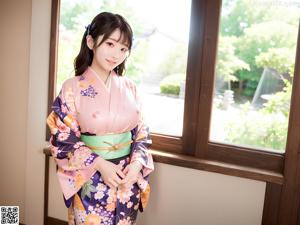 A woman in a kimono posing for the camera.