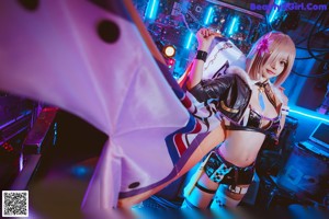 A woman in a cosplay outfit posing for a picture.
