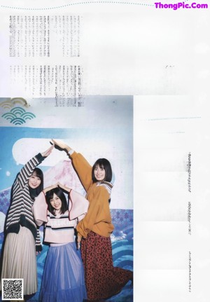 A group of three young women standing next to each other.