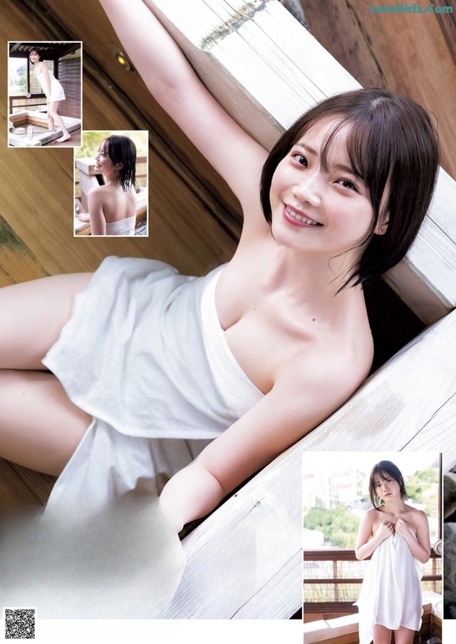 A woman in a white dress sitting on a wooden bench.